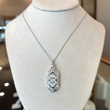 Vintage 1930's pendant with 1CT old European-cut diamonds and blue sapphire accents in 18KT white gold filigree KFK Jewelers Los Angeles 