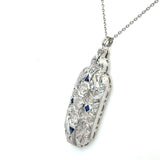 Vintage 1930's pendant with 1CT old European-cut diamonds and blue sapphire accents in 18KT white gold filigree KFK Jewelers Los Angeles 