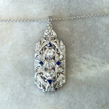 Vintage 1930's pendant with 1CT old European-cut diamonds and blue sapphire accents in 18KT white gold filigree KFK Jewelers Los Angeles 