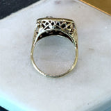 Vintage 1930s 14KT yellow gold onyx signet ring with filigree detail and two flush set diamonds KFK Jewelers Los Angeles