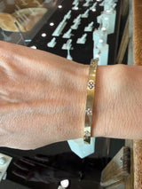 18KT yellow gold Roberto Coin Love in Verona diamond accent bangle bracelet .15CT round diamonds 4.5mm wide KFK Jewelers Los Angeles