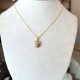Vintage 1950s 10KT yellow gold round locket with floral design KFK Jewelers Los Angeles