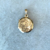 Vintage 1950s 10KT yellow gold round locket with floral design KFK Jewelers Los Angeles