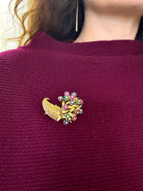 Vintage Tiffany & Co. 18K yellow gold cornucopia brooch pin with flowers "en tremblant" crafted in sapphires, emeralds, and rubies with a diamond center KFK Jewelers Los Angeles