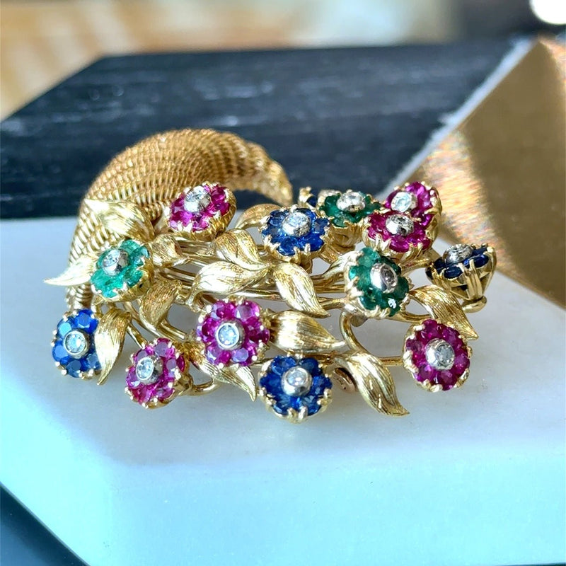 Vintage Tiffany & Co. 18K yellow gold cornucopia brooch pin with flowers "en tremblant" crafted in sapphires, emeralds, and rubies with a diamond center KFK Jewelers Los Angeles